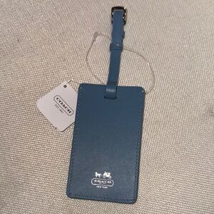 NWT, Coach leather luggage tag in a chambray blue .